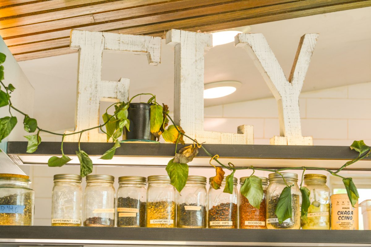 The word "Fly" in big white letters on top of a shelf