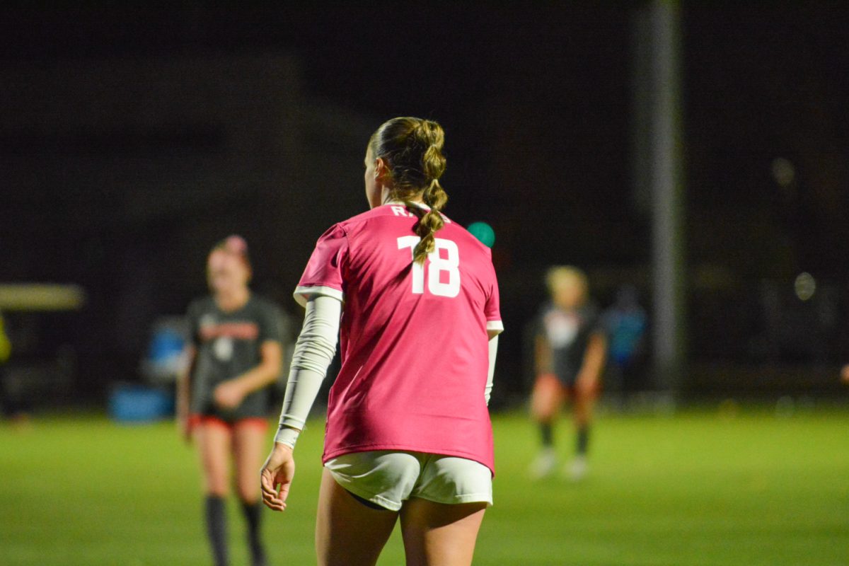 Girl in pink jersey walking