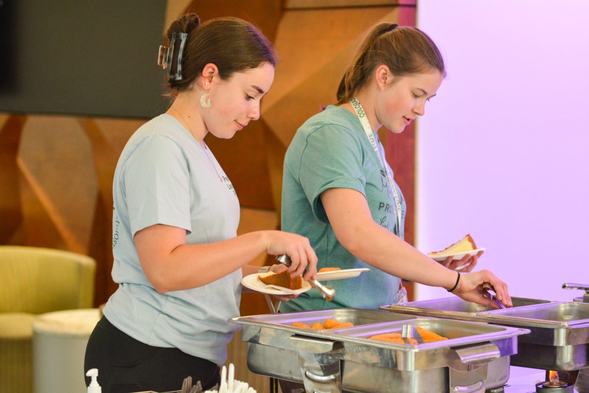 Two girls grabbing food