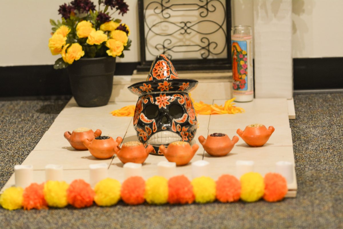 A representation of a grave decorated for the day of the dead Oct.4.  This grave is to represent mexican culture during the art exhibit “Street Vistas: Oaxaca’s Dia de Los Muertos” Oct. 4. This exhibit took place at the Global Village Museum of Arts and Cultures.