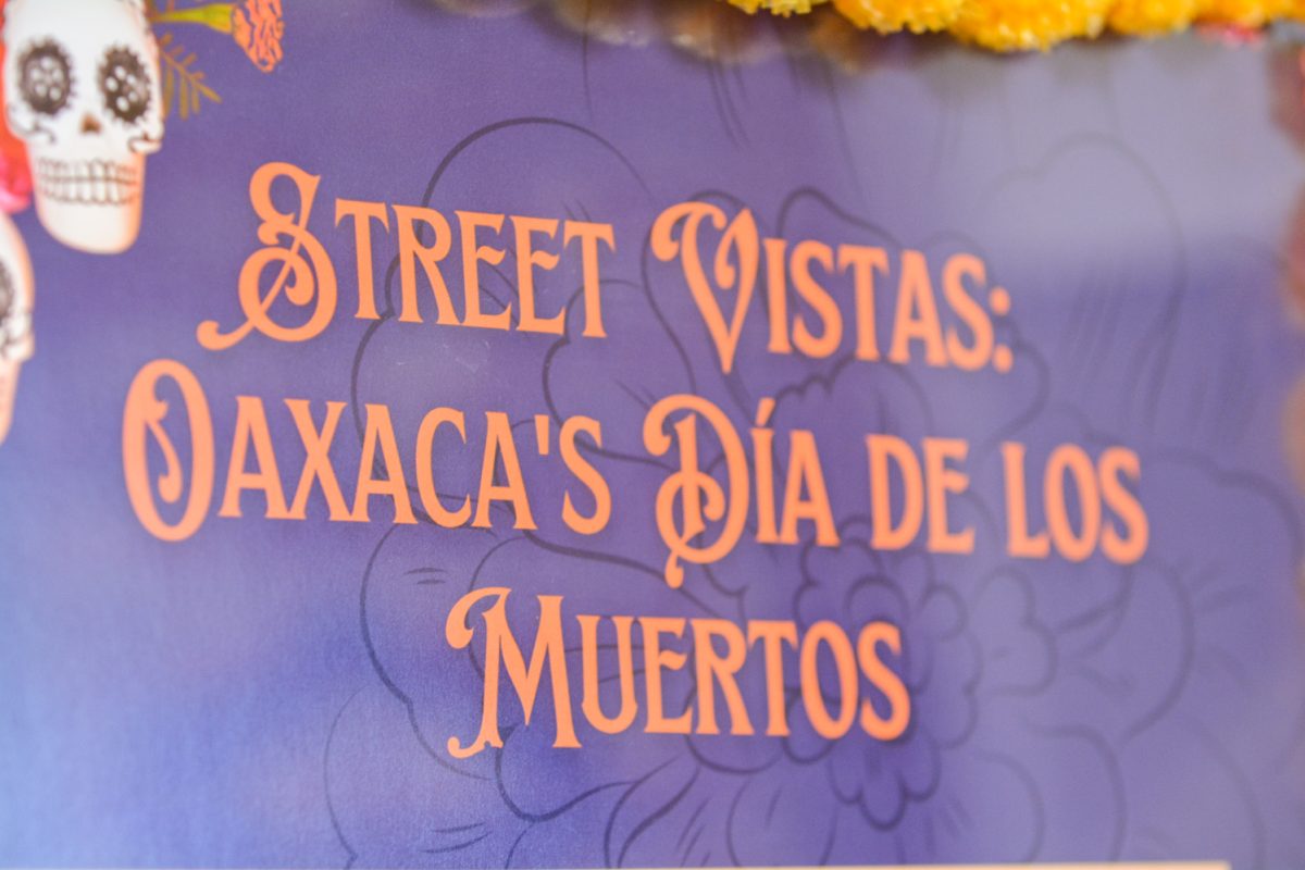 SIgn of the art exhibit “Street Vistas: Oaxaca’s Dia de Los Muertos” Oct. 4. This exhibit took place at the Global Village Museum of Arts and Cultures.