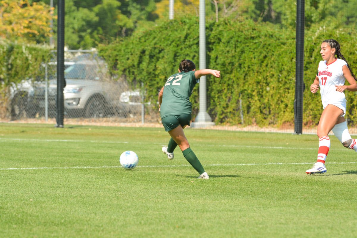 A soccer player kicking the ball