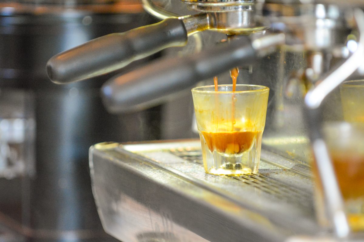 Espresso being dripped into a cup