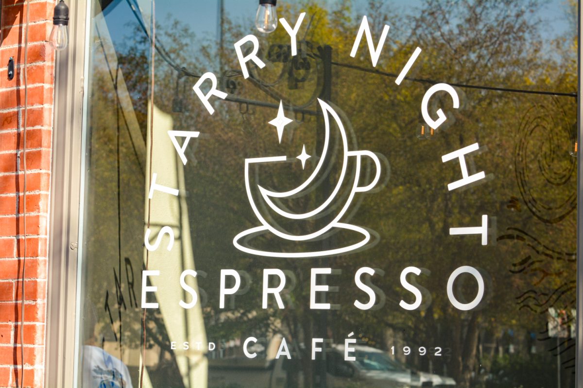 "Starry Night Espresso Cafe" sign on a window