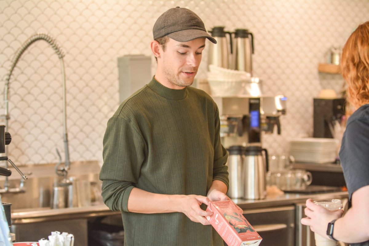 A barista talking to a customer