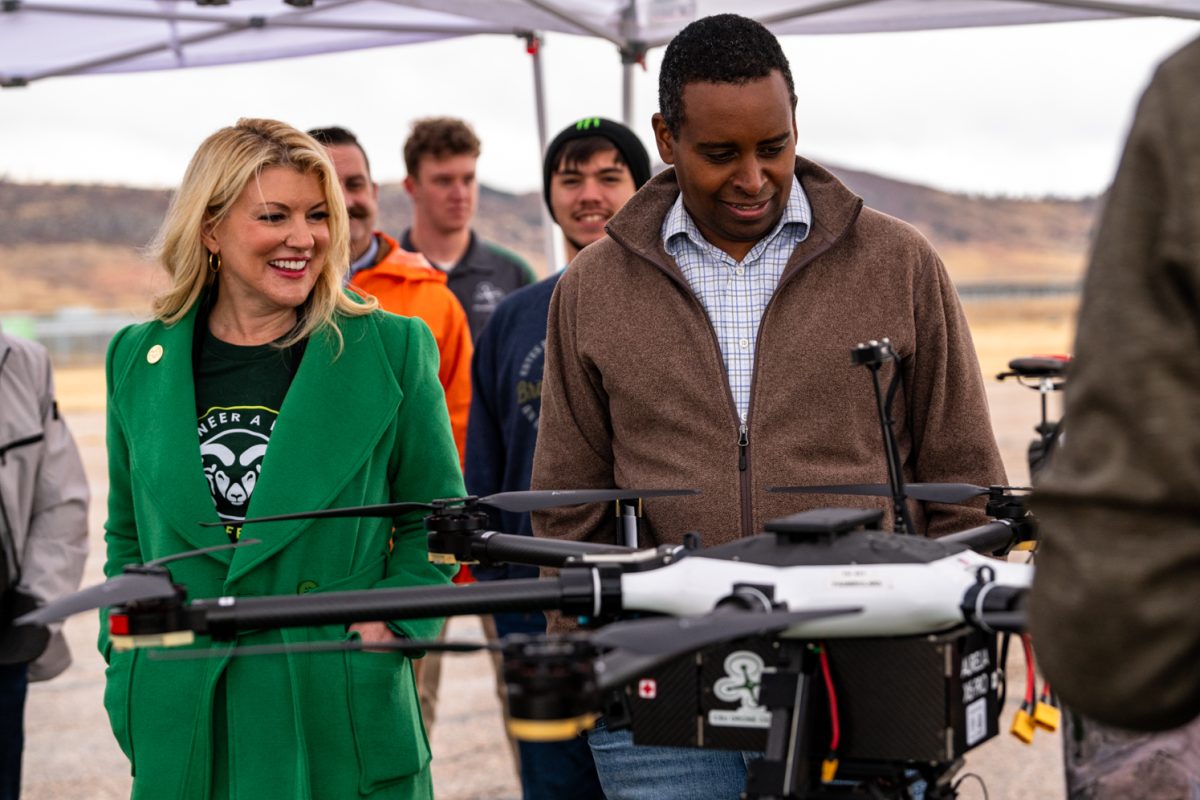 Colorado State University President Amy Parsons and Colorado State Representative Joe Neguse look at a Unmanned Ariel Vehicle at Christman Airfield in Fort Collins Colorado   Oct. 29 Rep. Neguse presented CSU with $500,000 thousand doallrs to renovate the airfield and aid in research of drones for use in emergency services.