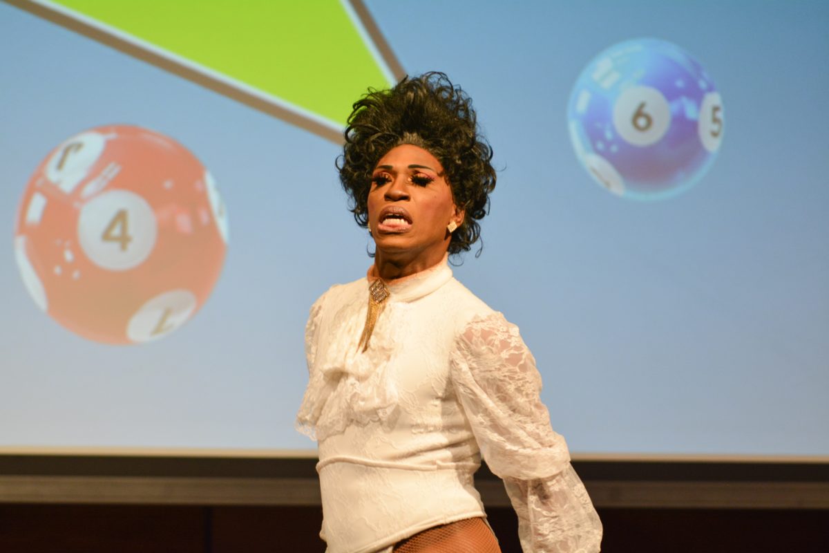 Performer in a white bodysuit posing