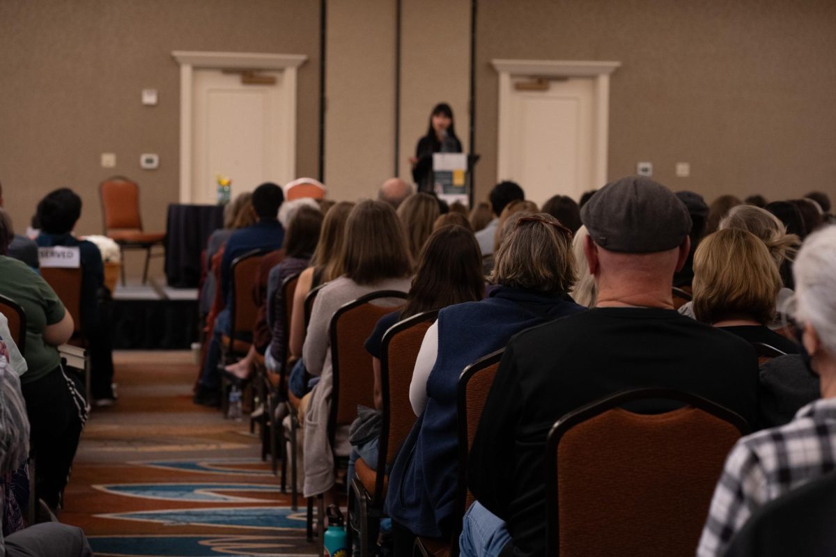 A packed crowd at the Fort Collins Marriott listens to author R.F Kuang's talk, focused on. her experiences in the literary field and representation in novels. Kuang's 2023 book, "Yellowface," is the Fort Collins 2024 City-Wide Read. 