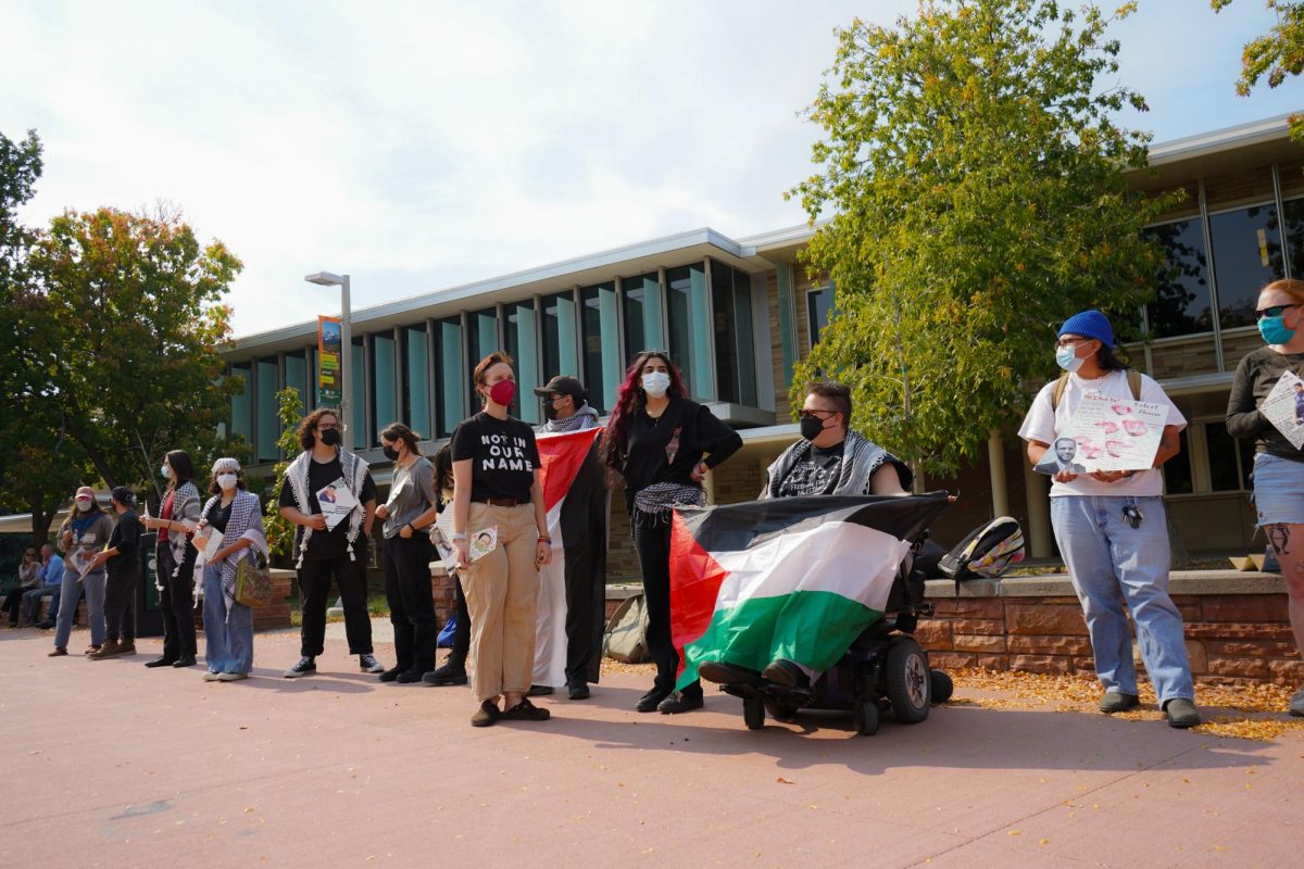 Members of Students for Justice Palestine on The Plaza Oct. 7 take part in the Walk Out For Palestine demonstration. The demonstration was organized to mark one year since the start of the Israel-Hamas war. 