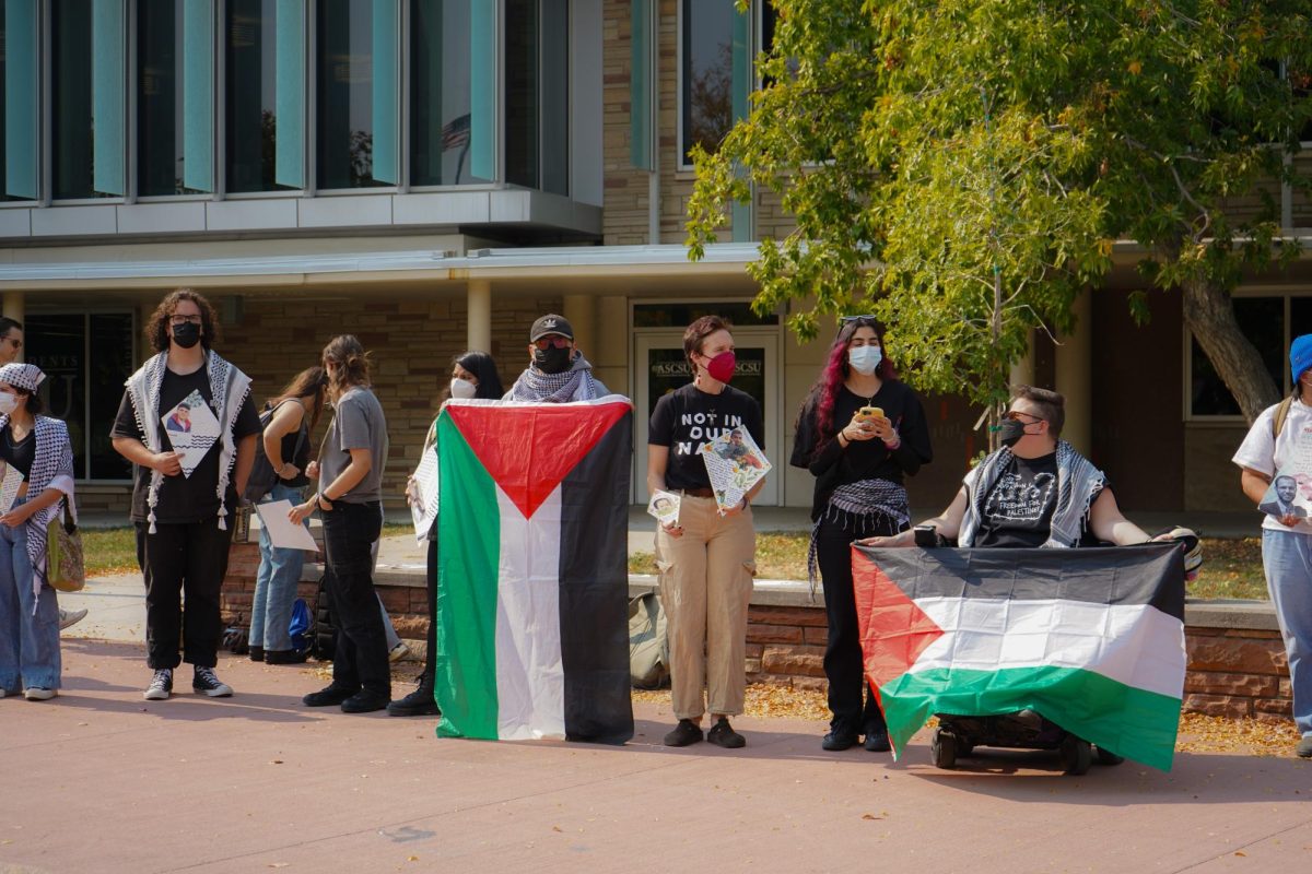 Ella Smith and members of Students for Justice Palestine on The Plaza Oct. 7 take part in the Walk Out For Palestine demonstration. The demonstration was organized to mark one year since the start of the Israel-Hamas war. 