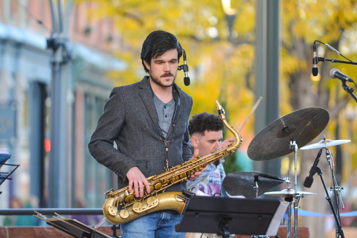 A man holding a saxophone 