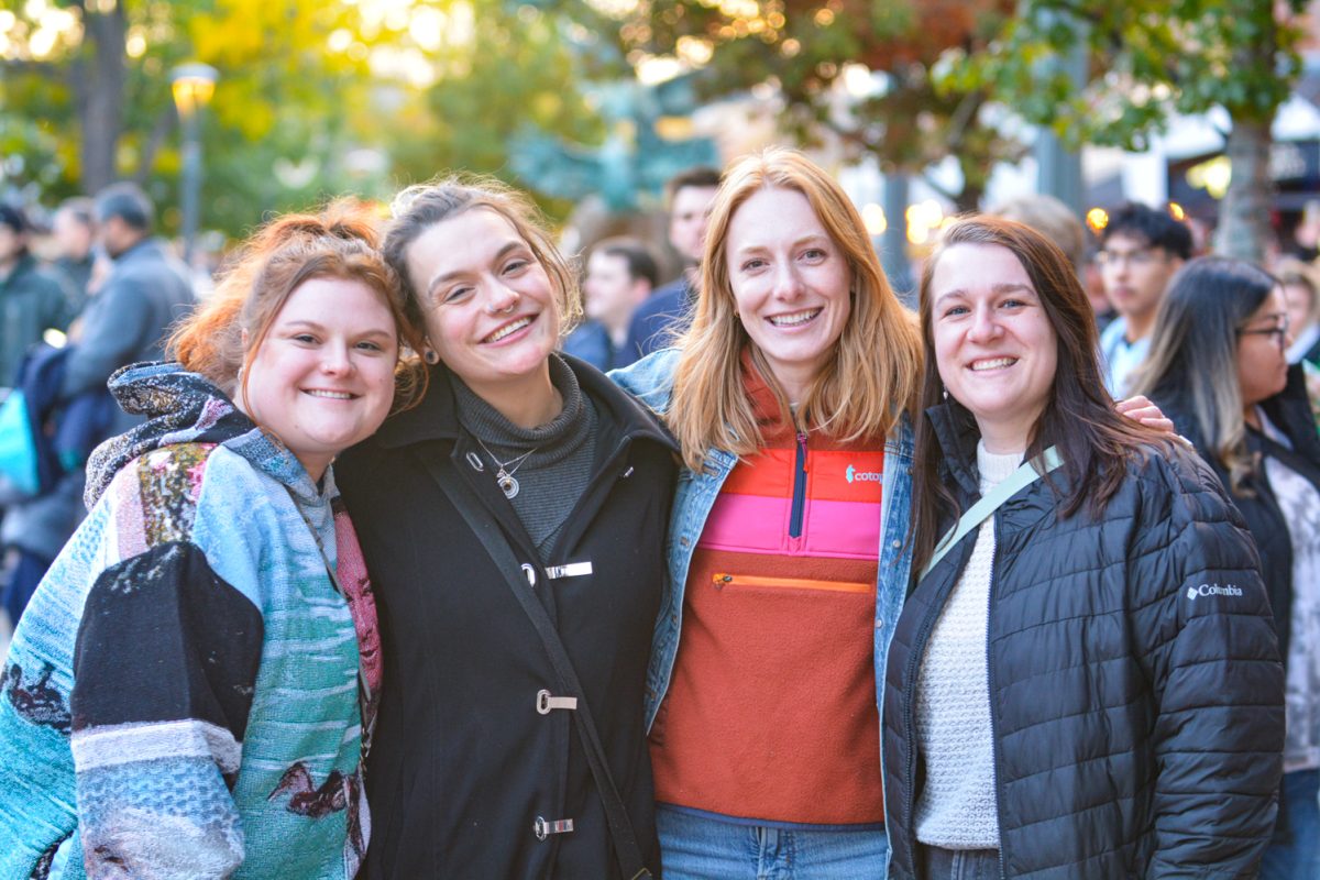 Four women smiling