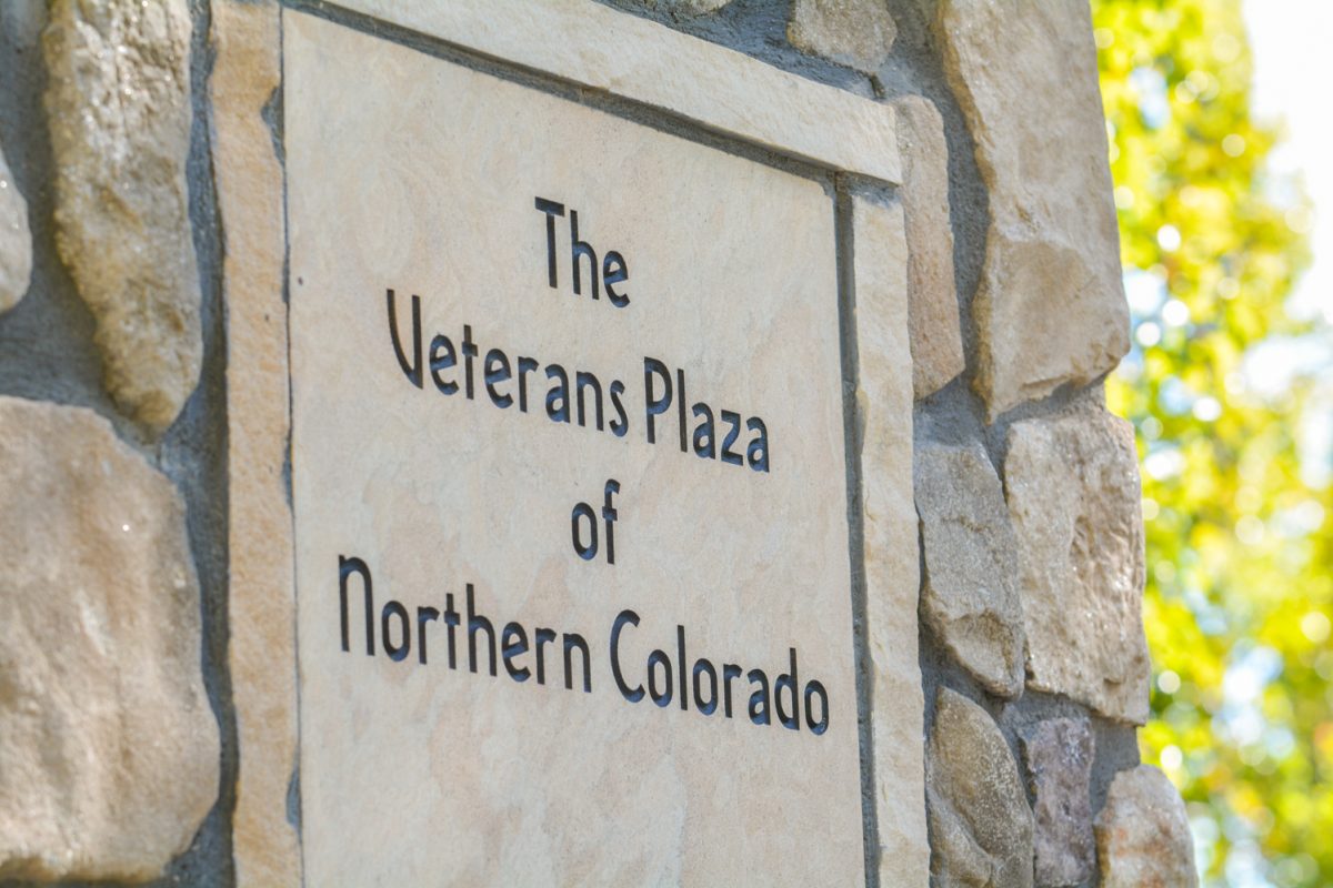 A sign that states "The Veterans Plaza of Northern Colorado"