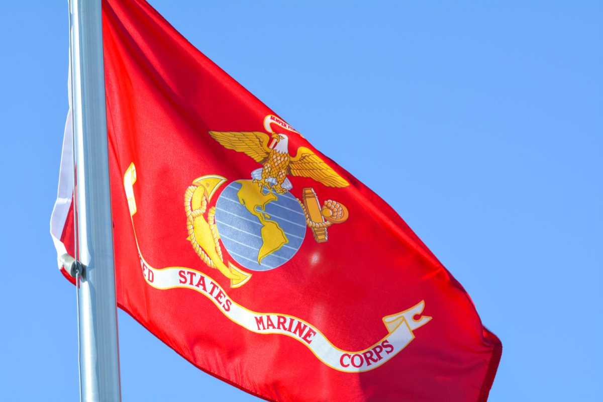 A red flag with the united states marine corps symbol