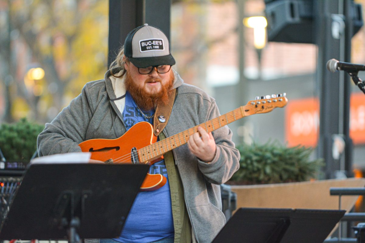 A man playing a guitar