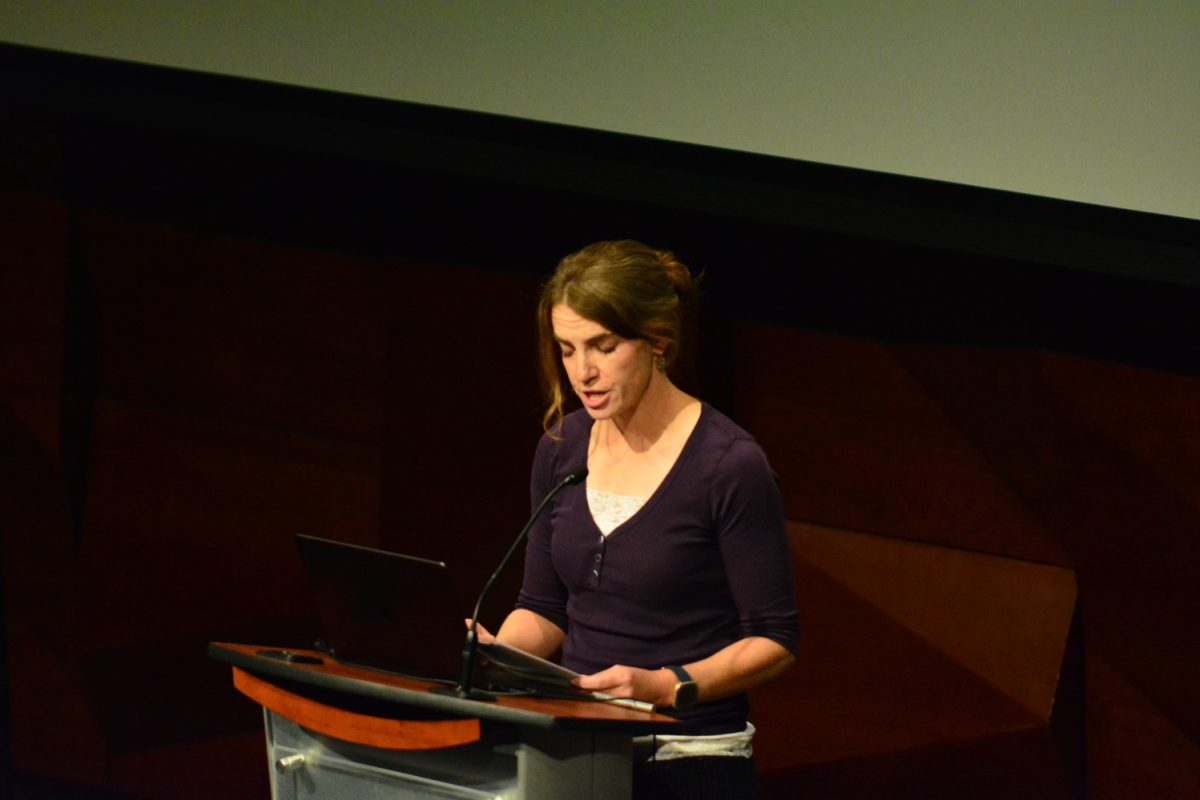 A woman talking into the microphone