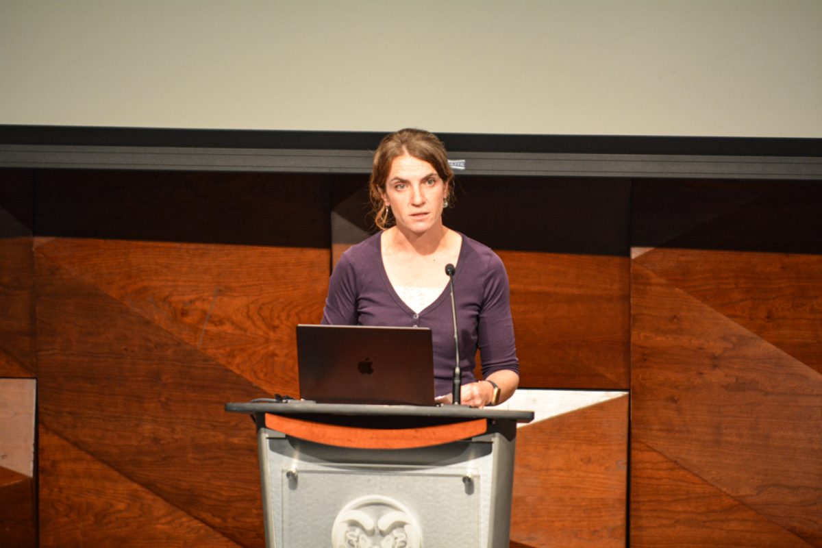 A woman talking into a microphone