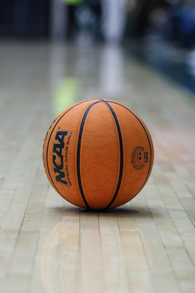 A basketball sits on the court inside Moby Arena.