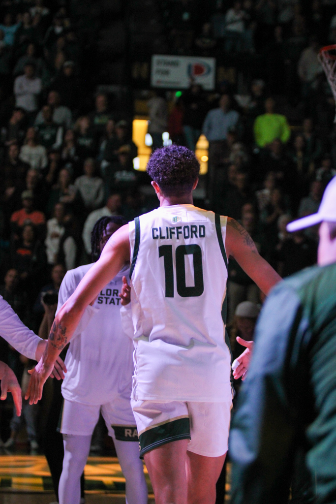 Nique Clifford (10) high fives his teammates as he's announced as a starter.