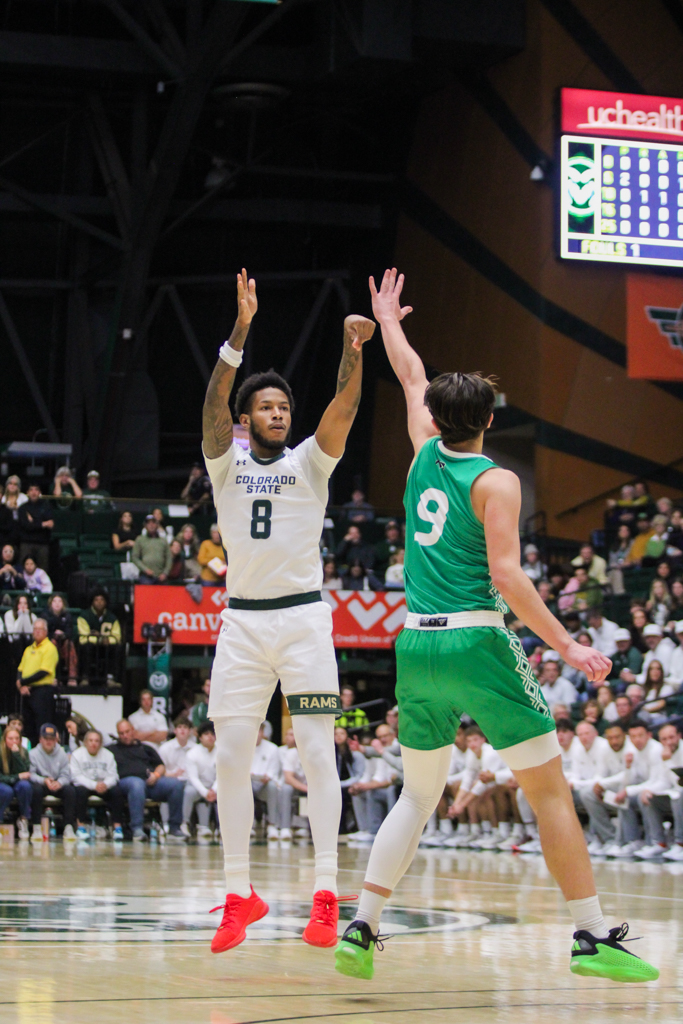 Jaylen Crocker-Johnson (8) shoots a three-pointer.