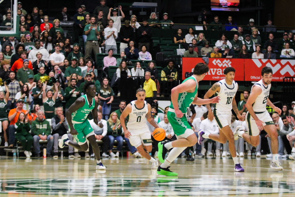 Colorado State University guard Kyan Evans (0) brings the ball down the court.