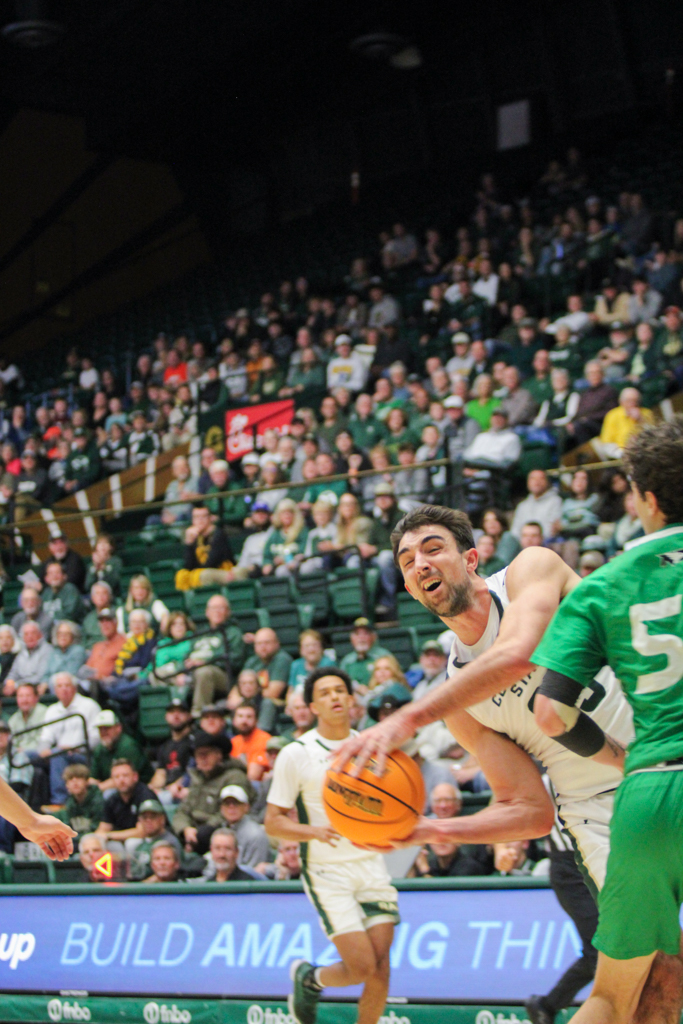 Ethan Morton (25) dodges a block from North Dakota.