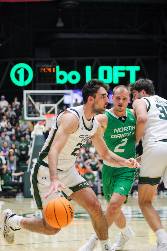 Ethan Morton (25) darts towards the basket.
