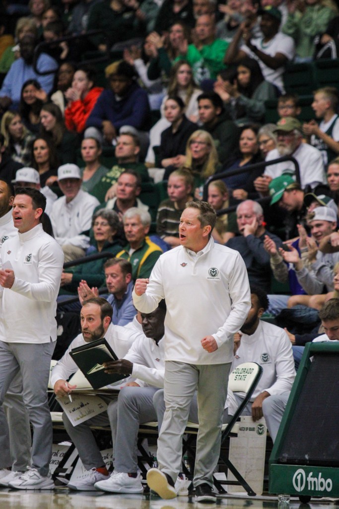 Colorado State Men's Basketball coach Niko Medved fist pumps after a steal from CSU.