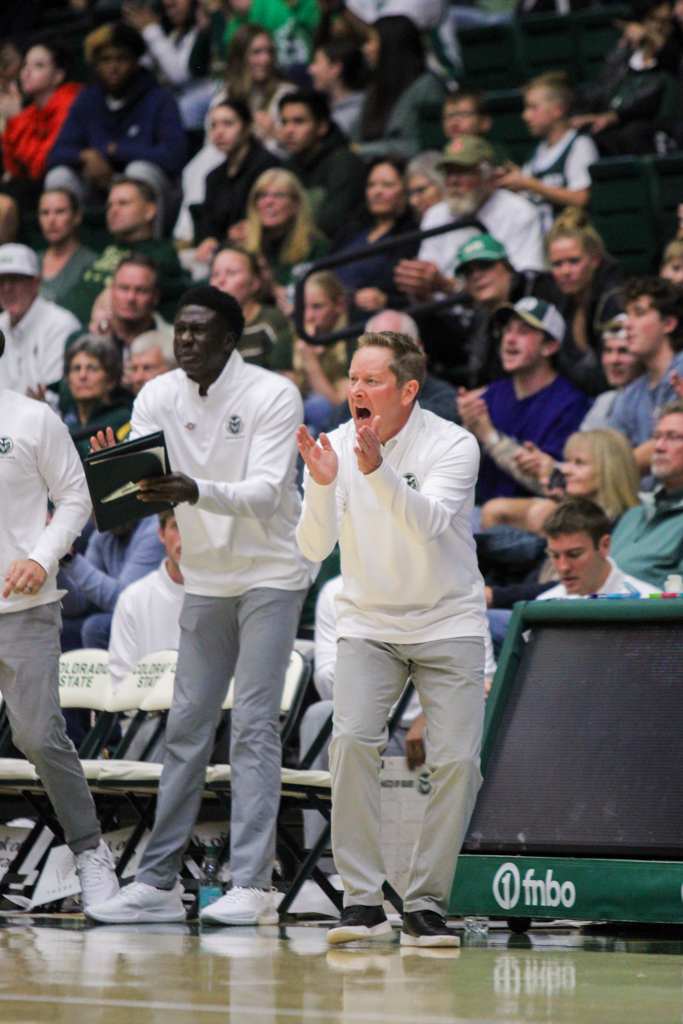 Niko Medved, the Colorado State Men's Basketball head coach, cheers.