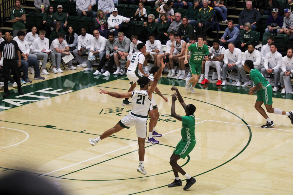 Rashaan Mbemba (21) tries to block a shot from North Dakota.