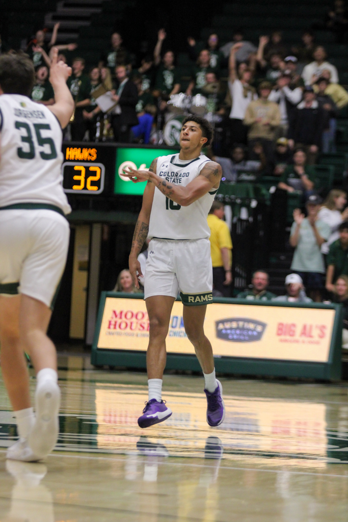 Nique Clifford (10) celebrates after making a three-pointer.