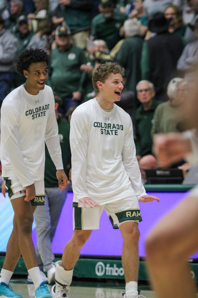 Bowen Born celebrates a teammates dunk during warm ups.