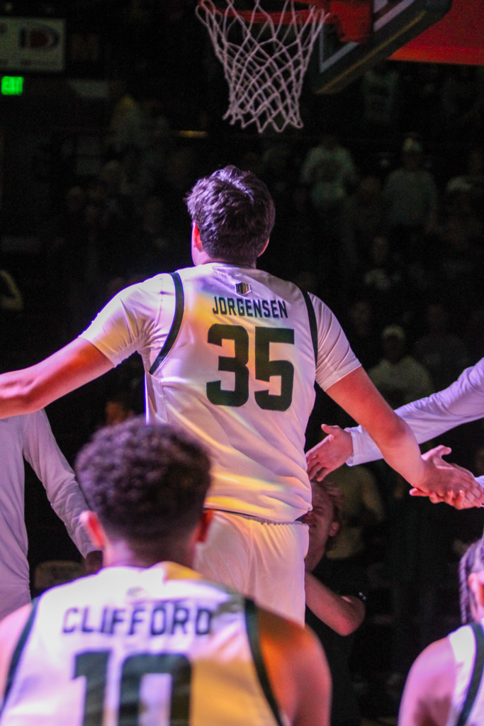 Colorado State forward Kyle Jorgensen (35) high fives his teammates as he is announced as a starter.