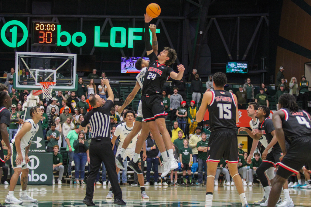Colorado State's Nique Clifford (10) and University of Denver's Isaiah Carr (24) jump for tipoff.