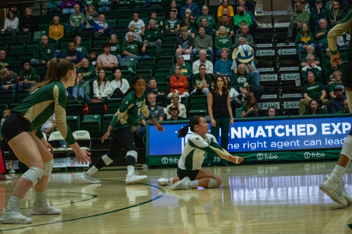 A volleyball player digs the ball.