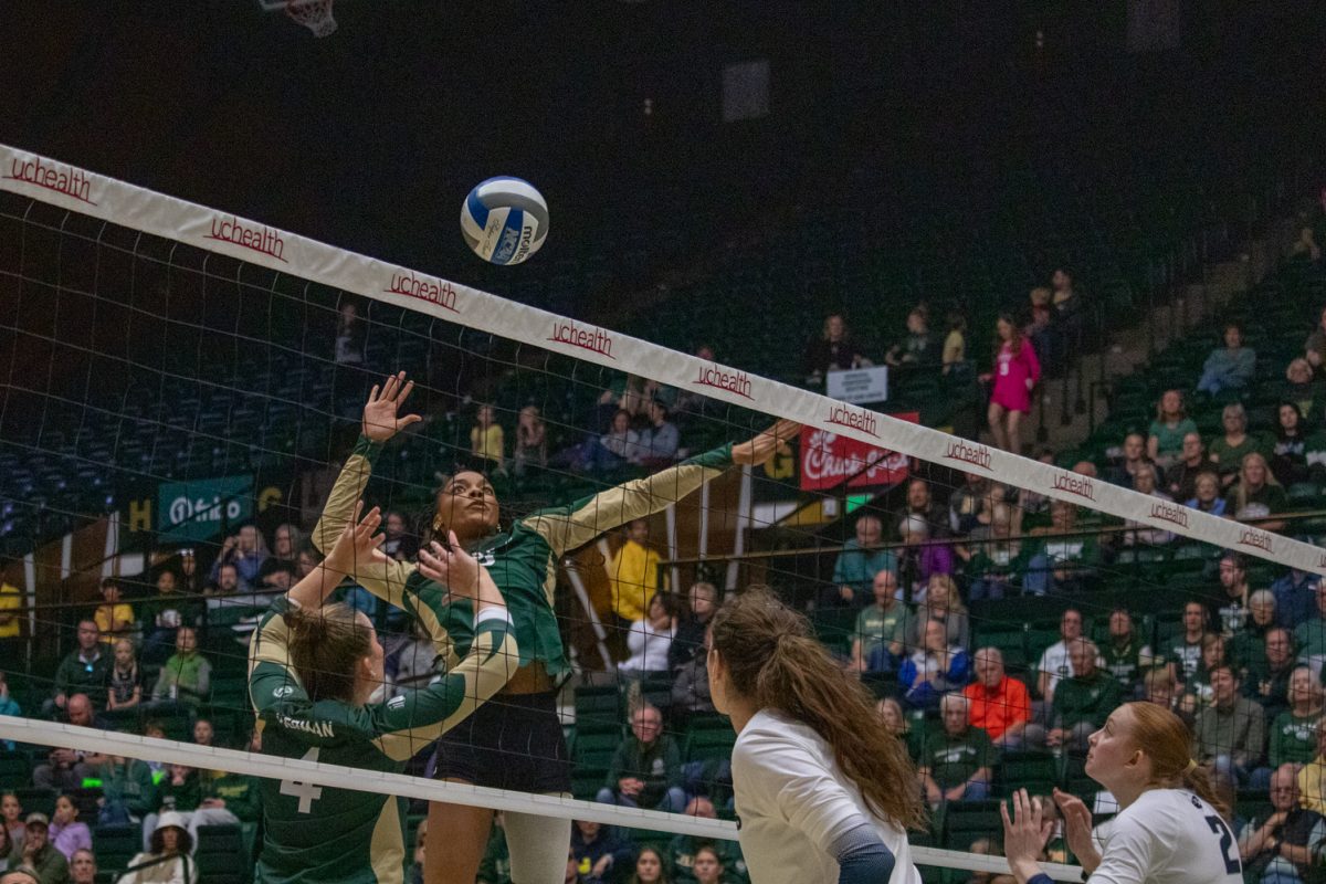 A volleyball player attacks the ball during a game.