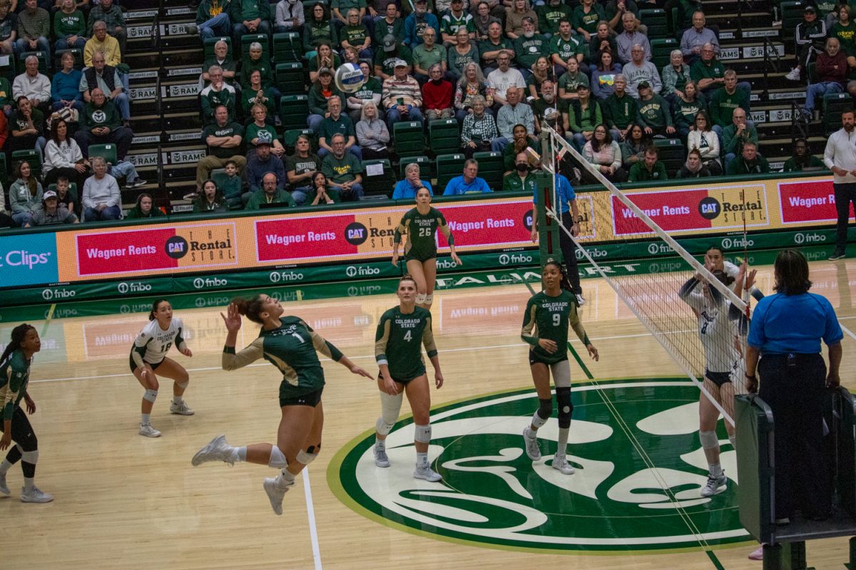 A volleyball player attacks the ball.