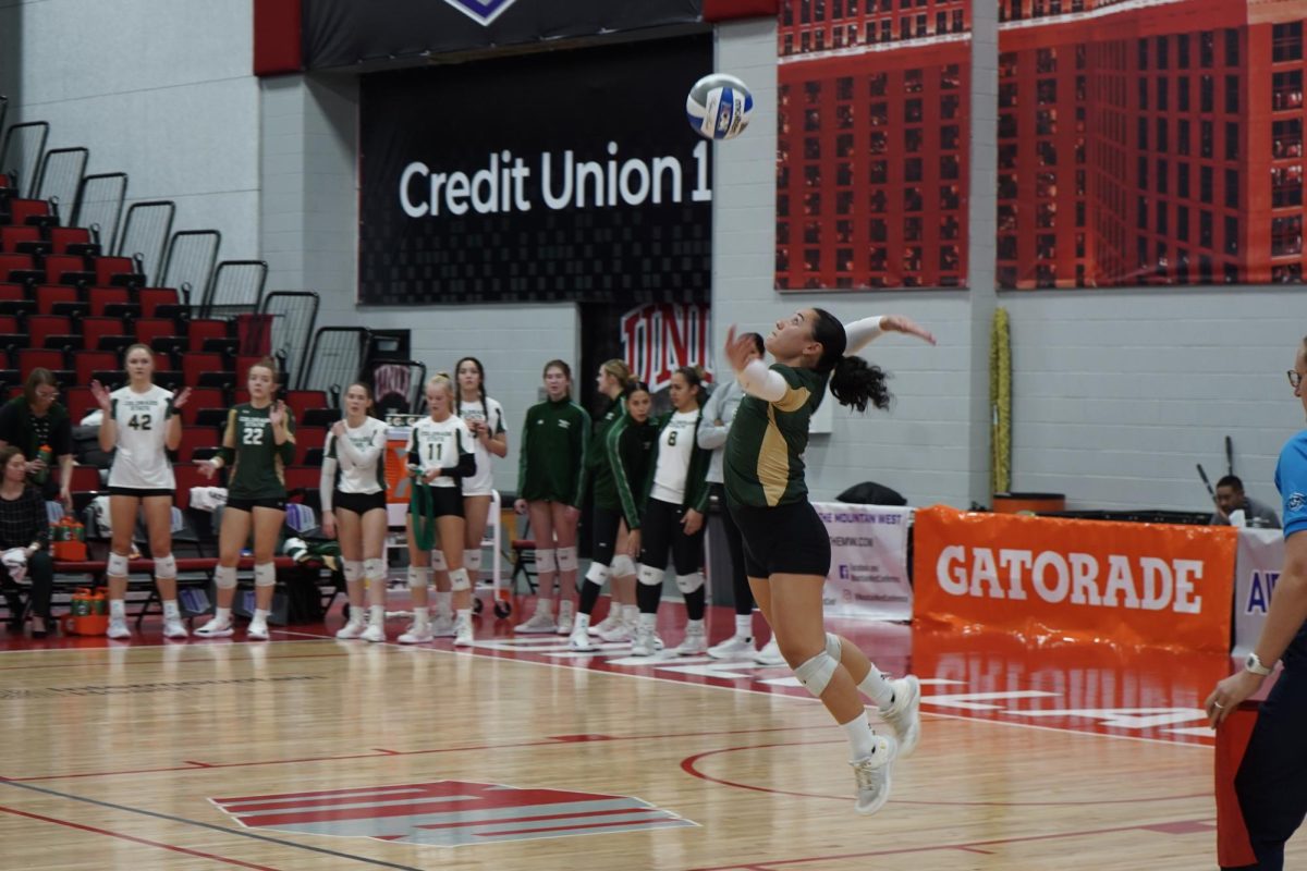 Kate Yoshimoto (18) serves the ball in game against San Diego State Nov. 29. The Rams won 3-1. 