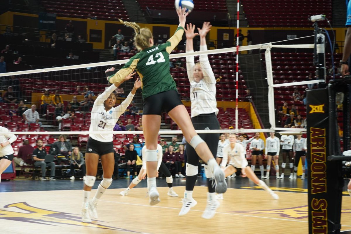 Karina Leber (42) tipping the ball in game against Texas A&M Dec 6. Colorado State volleyball lost 1-3 in first round of NCAA tournament.