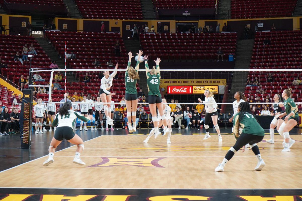 Marina Brun (26) and Karina Leber (42) blocking in game against Texas A&M Dec 6. Colorado State volleyball lost 1-3 in first round of NCAA tournament.