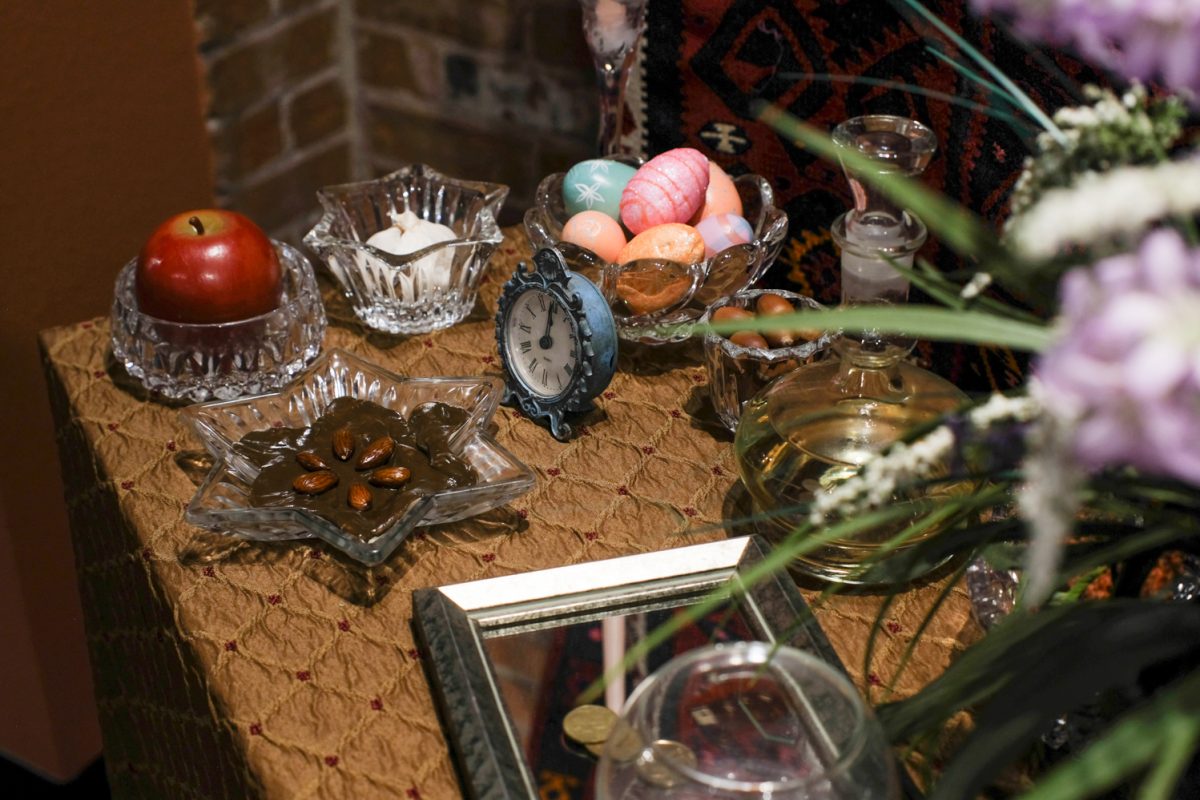 A table full of detailed items such as decorated eggs and flowers highlights traditions of the Persian New Year Nowruz Jan. 24. This was one display at Ringing in the New: New Year Traditions Around the World, an exhibit at Global Village Museum of Arts and Cultures.