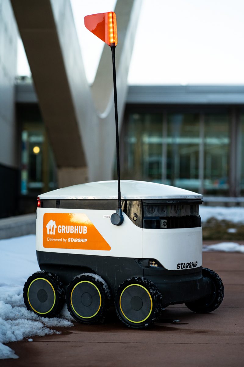 A Starship food delivery robot powers on outside the Lory Student Center Jan. 27.