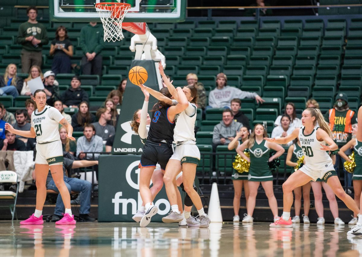 Jadyn Fife (5) and Marta Leimane (14) battle for possession against Boise State on Tuesday, 1/21. The Colorado State University Women's Basketball Team took the win with an end score of 79-70. 