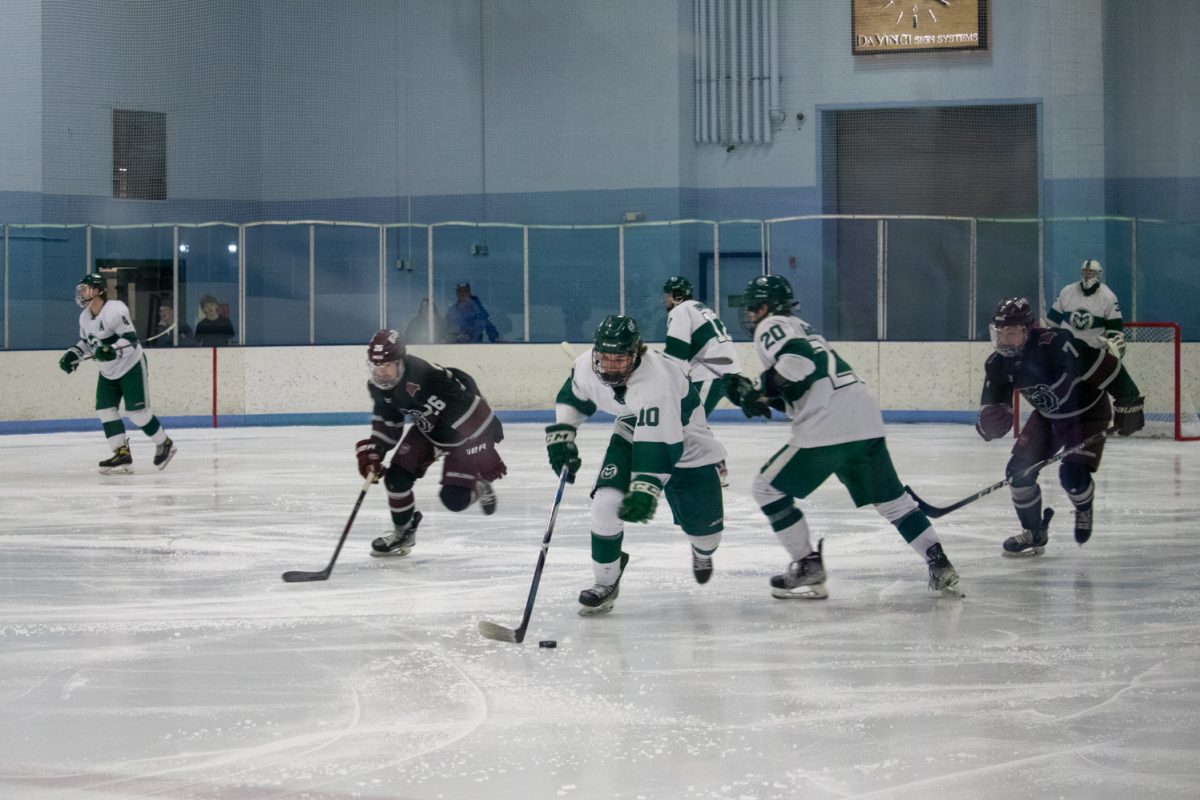 Forward TJ Norris gains control of the puck during Colorado State University's match against Missouri State University Jan. 31. The Rams lost to the Bears 5-4.