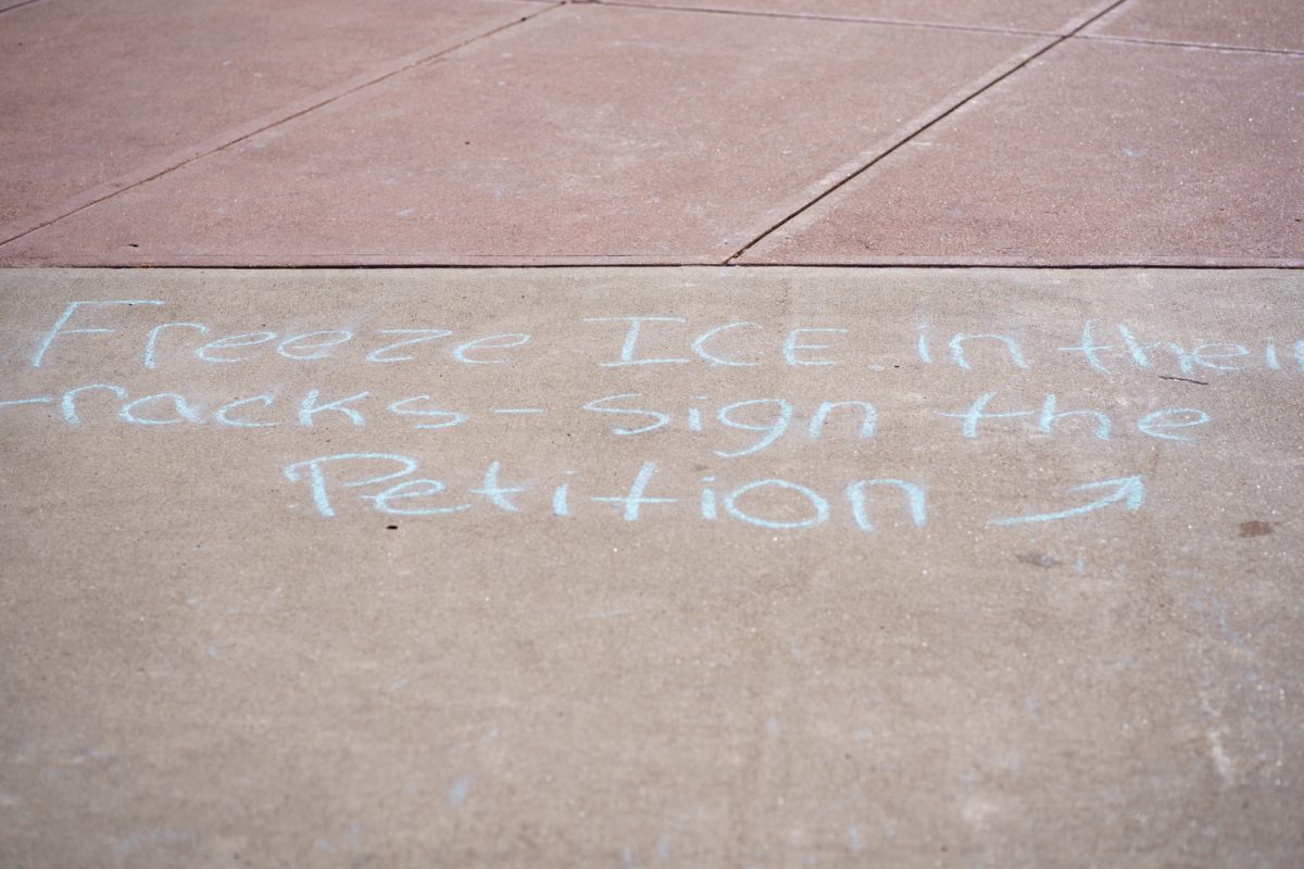 Chalk is written across the Lory Student Center Plaza to let students know about a Young Democratic Socialists of America petition to make Colorado State University a sanctuary campus Feb. 4.