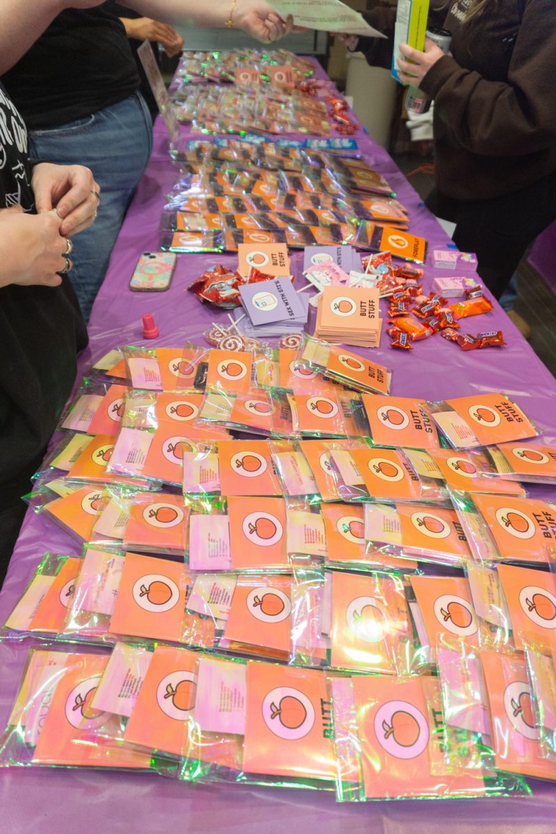 Giveaway items line a table.