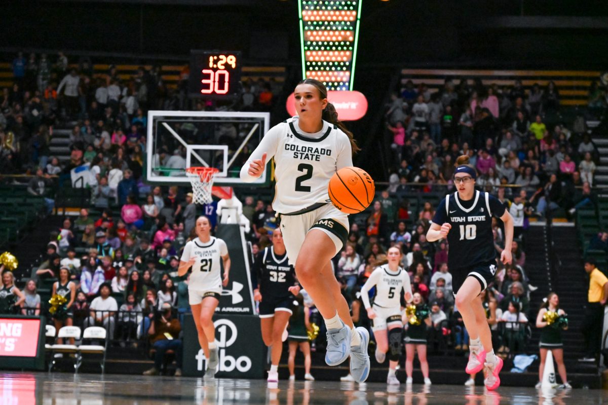 Brooke Carlson (2) takes the ball down the court towards Colorado State University's basket during the Colorado State University vs. Utah State basketball game. Feb. 12. CSU won 72-54