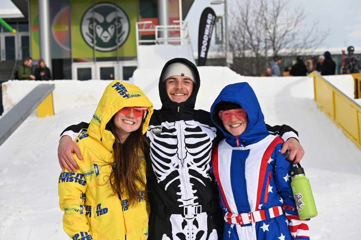 Grace Moerman, Addison Johnson and former Snowriders President Ella Peters pose in front of the RailJam obstacles before the Colorado State University and Woodward Eldora RailJam Feb. 13.