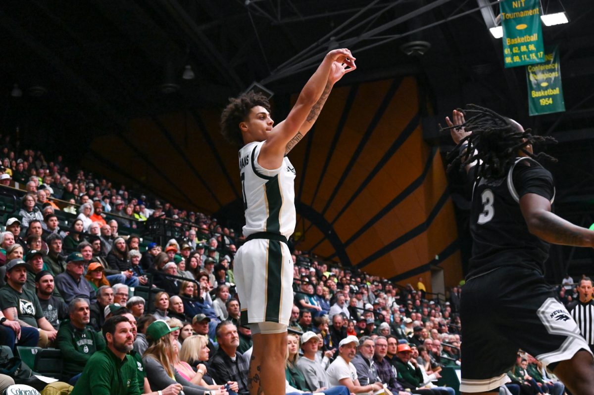 Guard Kyan Evans shoots and scores a 3-pointer during the Colorado State University men's basketball game against the University of Nevada, Reno Feb. 18. CSU won 79-71.