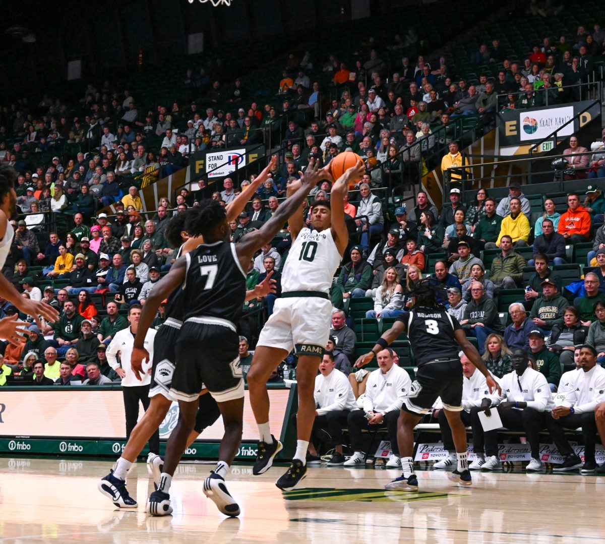 Nique Clifford (10) throws the ball to an open player during the Colorado State University vs. University of Nevada basketball game Feb. 18. CSU won 79-71